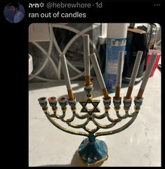 a menorah with candles in it sitting on a table