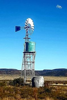 an old windmill in the middle of nowhere