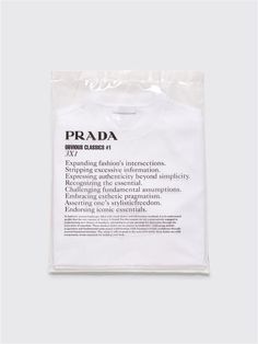 a white t - shirt with the words prada printed on it