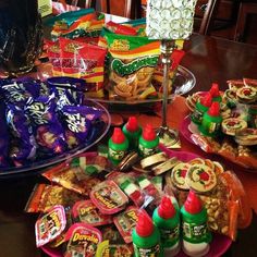 a table filled with lots of snacks and condiments on top of each other