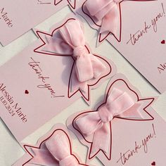 three pink bows with thank you notes attached to the back of each bow are shown