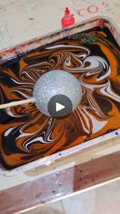 an artistic painting being made with paintbrushes