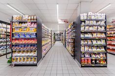 an aisle in a grocery store filled with lots of food