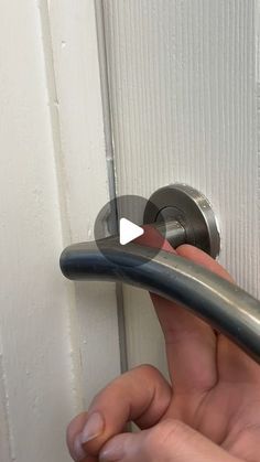 someone is opening the door with their thumb