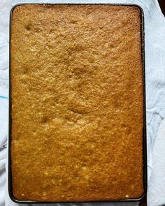 a square cake sitting on top of a white napkin