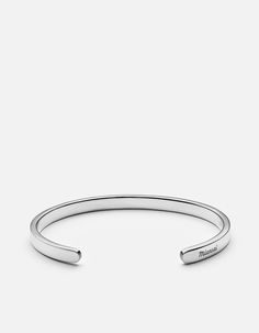 The minimal slip-on Singular Cuff for men, is a timeless classic that transcends seasons and looks good with any outfit. It’s slightly adjustable in size ranging from small to large and has a polished exterior and interior finish. Available for monogram personalization. Also available in matte silver, polished 14k gold, polished black, matte brass and matte silver/matte gold. All sales on personalized and custom items are final. Monograms are uppercase and limited to the 26 letters and numbers 0 Silver Bracelet Designs, Mens Cuff Bracelets, Mens Cuff, Mens Bracelet Silver, Twisted Bracelet, Wrist Jewelry, Silver Jewels, Bracelet Sterling Silver, Sterling Silver Mens