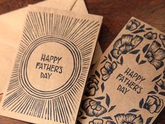 two fathers day cards on top of each other