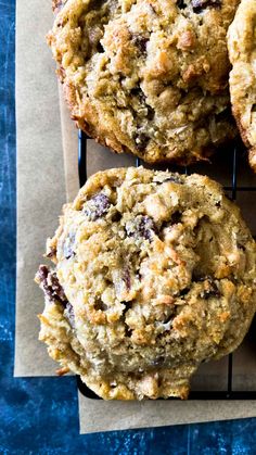 three chocolate chip muffins sitting on top of each other