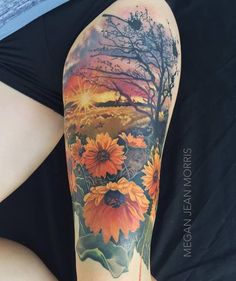 sunflowers and trees are featured on this tattoo artist's half - sleeve