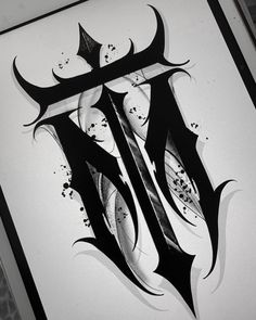 a black and white drawing of the letter h in gothic style with splatters