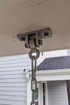 a chain is attached to the side of a house