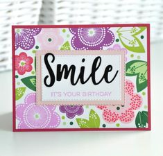 a card that says smile it's your birthday with flowers and leaves on it