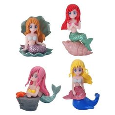 four little mermaid figurines sitting on top of each other in different colors and sizes