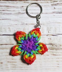 a multicolored flower shaped keychain on a wooden surface