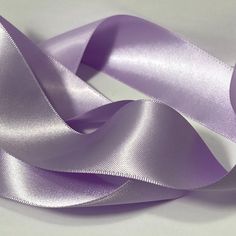 purple satin ribbon on white background