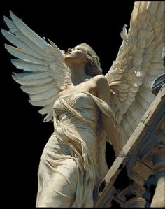 an angel statue with its wings spread out