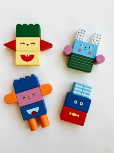 Colorful wooden blocks that can inspire children to stack, mix and build their own funny and cheerful characters. The possibilities are endless! Dimensions: Box measured 6”w x 1”d x 12”h Each includes 22 colorful wooden blocks 100% wood from well managed forest Designed by Kikkerland Designs. Made in China. Recommended for ages 3 and up. Diy Montessori Toys, Balance Game, Wooden Toy Boxes, Teeter Totter, Diy Educational Toys, Wooden Building Blocks, Diy Montessori, Wooden Building, Kids Blocks