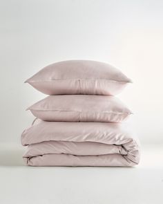 four pillows stacked on top of each other