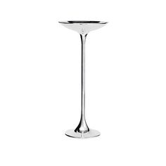 a tall glass vase sitting on top of a table