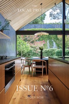 the cover of issue no 6, featuring an image of a kitchen and dining area