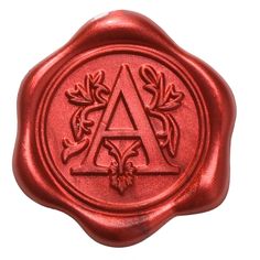 a wax stamp with the letter a in it's center and leaves on top