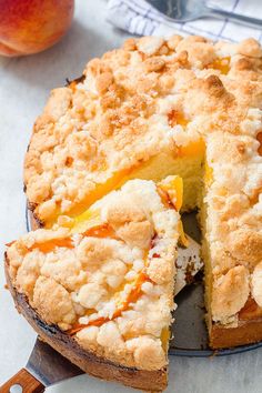 a peach cobbler pie with one slice cut out