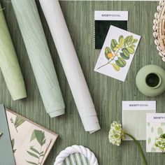 the table is covered with different items such as cards, flowers and other things that are on it