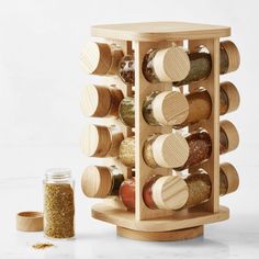 a wooden spice rack filled with spices