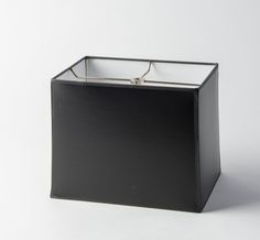 a square black box with a metal handle