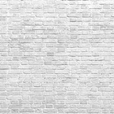 A textured background depicting a wide feature wall of Great White Wall Wallpaper Mural from Decor2Go Wallpaper Mural with visible details and variations in the brick sizes and arrangement.