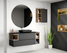 a bathroom with a sink, mirror and shelves on the wall next to each other