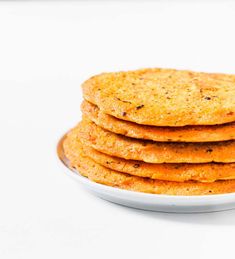 a stack of crackers sitting on top of a white plate