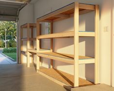 an empty room with wooden shelves in it