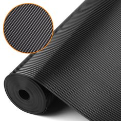 a roll of black yoga mat with an orange stripe on the top and bottom side