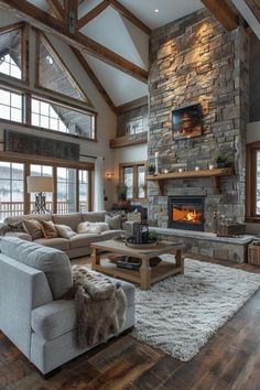 a living room filled with lots of furniture and a fire place in the middle of it