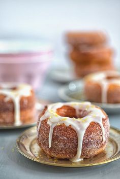 a bundt cake with icing and sprinkles sitting on a plate