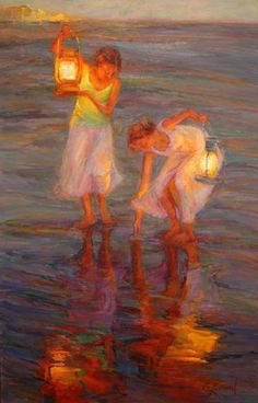 two women are standing in the water with a lantern