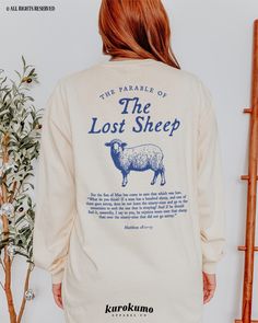 This Unisex garment-dyed long sleeve t-shirt features "The Parable of the Lost Sheep | Matthew 18:11-13" with a vintage sheep illustration on the back and "He left the ninety-nine to rescue me" on the front. Spread God's love and the gospel with this Christian tee <3 Make sure to check out the other garment options below :) » O P T I O N S « ‣ Tshirt: https://www.etsy.com/listing/1678902467 ‣ Crewneck: https://www.etsy.com/listing/1585469082 ‣ Hoodie: https://www.etsy.com/listing/1649314138 ‣ To T Shirt Design Christian, Christian T Shirts Designs, Christian Shirt Ideas, Gospel Clothing, Bible Verse Long, Jesus Parables, Jesus T Shirts, Minimalist Tshirt Design, Church Tshirt