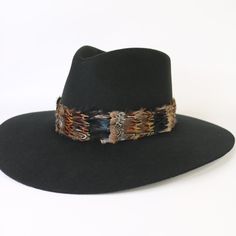 Natural feather hat band. Adjustable with a leather tie. Natural colored feathers Adjustable hatband Approx. 1 inch wide *This product is for 1 single hat band. Hat not included. Adjustable Flat Brim Felt Hat For Town, Adjustable Western Hat For Town, Western Style Adjustable Hat For Town, Adjustable Wide Brim Fedora For Town, Adjustable Black Hat Band For Kentucky Derby, Adjustable Fedora Felt Hat For Town, Adjustable Flat Bill Hat Bands For Fall, Feather Hat Band, Cowboy Hat Band