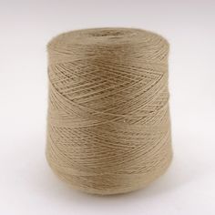 a spool of yarn on a white background