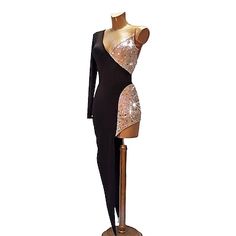 a black and gold dress on a mannequin