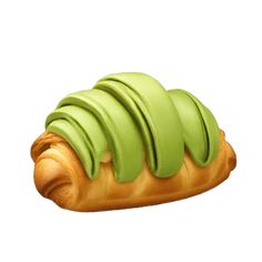 a croissant with green icing on it's side, sitting in front of a white background