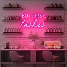 a pink neon sign that says, but first lashes