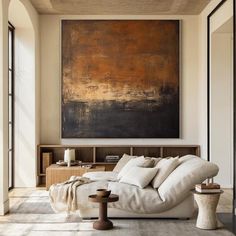 a living room with a large painting on the wall