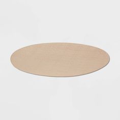 an oval wooden table top on a white background with no one around it or someone else