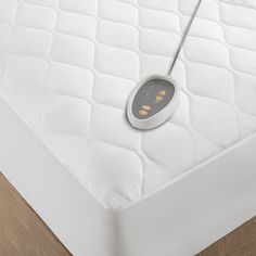 an electronic device on top of a mattress