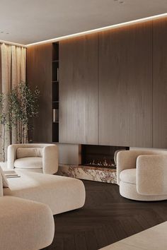 a living room with white furniture and a fire place in the corner, along with wood paneling