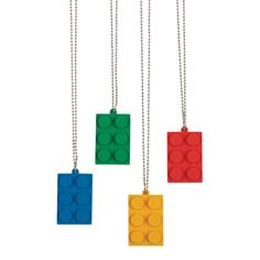 three lego necklaces with different colors and designs on them, one is yellow, the other is red