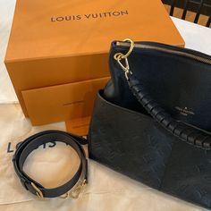 Authentic Louis Vuitton Black Empreinte Maida Hobo. #M45522 Great Condition. A Small Amount Of Wearing On The Bottom Corners. Purchased From Lv Online. Comes With Dust Bag, Large Lv Box Gift Receipt, Paperwork And Gift Tag. The Maida Hobo Comes With A Detachable Braided Strap And A Detachable Flat Leather Strap, A Top Zip Closure, And 2 Exterior Slip Pockets, And 2 Interior Slip Pockets. Maida Louis Vuitton, Designer Black Hobo Bag With Removable Pouch, Louis Vuitton Low Key Hobo, Louis Vuitton Maida Hobo, Louis Vuitton Maida Hobo Bag, Louis Vuitton Thick Strap Bag, Louis Vuitton Loop Hobo Bag, Louis Vuitton Empreinte, Louis Vuitton Black