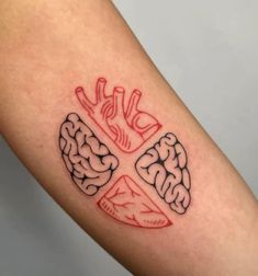 a tattoo on the arm of a person with a cross and brain in the middle